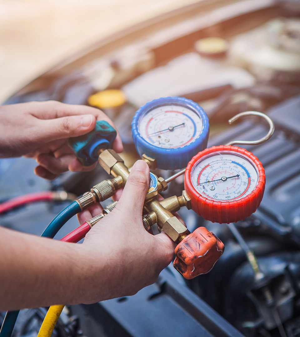 Auto mechanic Worker hands holding monitor to check and fixed